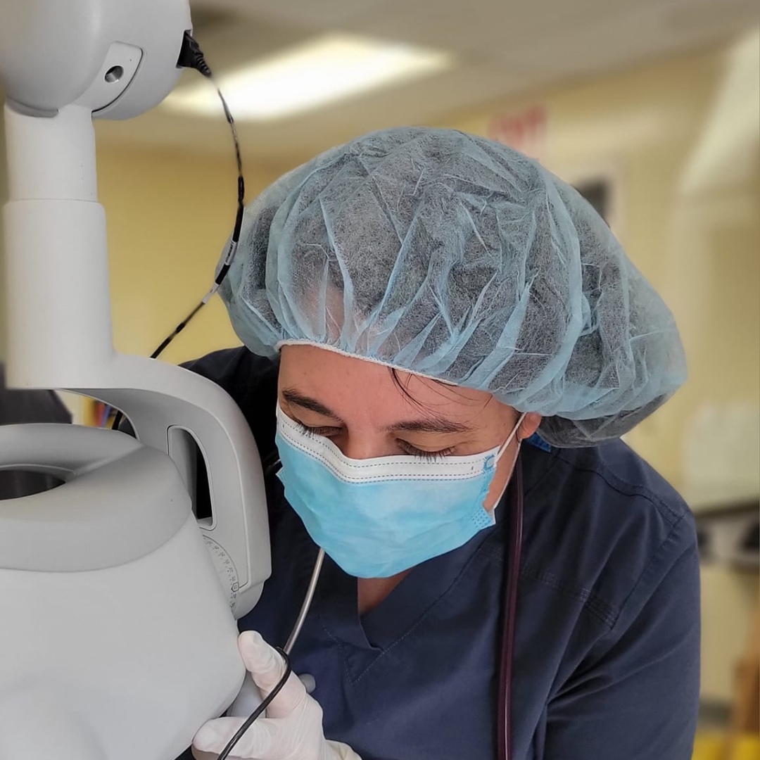 vet in scrubs, mask, and hair cap vet in scrubs, mask, and hair cap